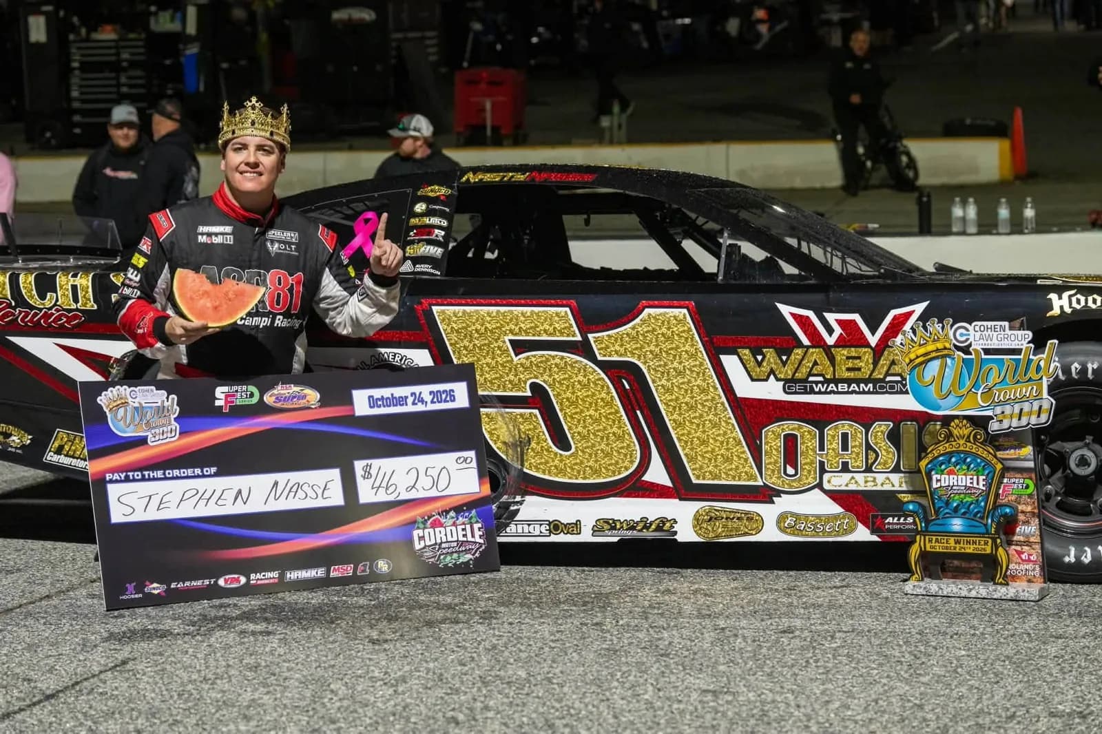 Stephen Nasse in victory lane with the trophy after winning the 2026 World Crown 300.