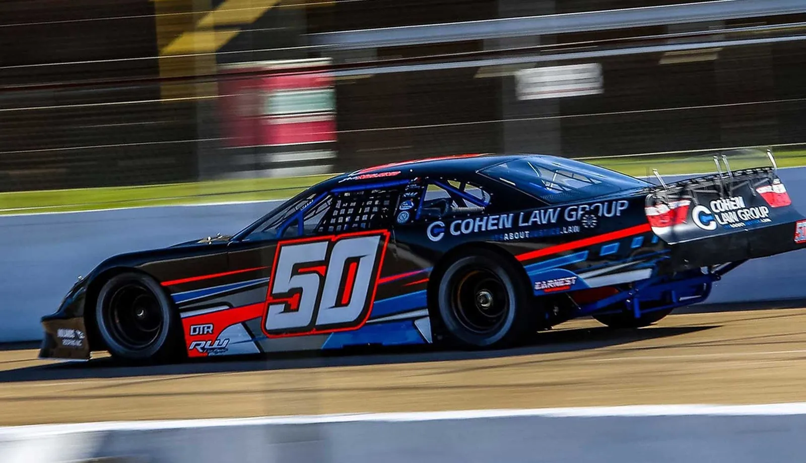 The #50 late model at speed along the wall at Cordele Motor Speedway